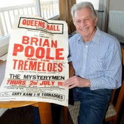 Local musician Brian Tilke of The Mysterymen with show poster Credit North Devon Journal